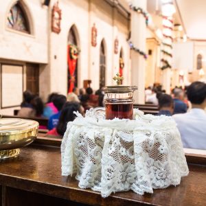 Catholics bread and wine in chalice with crucifix